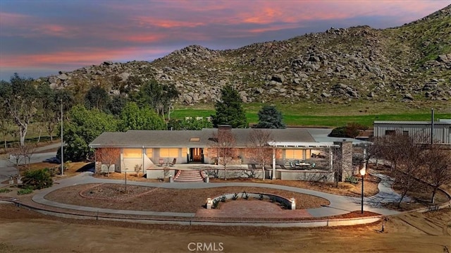 rear view of property featuring a mountain view