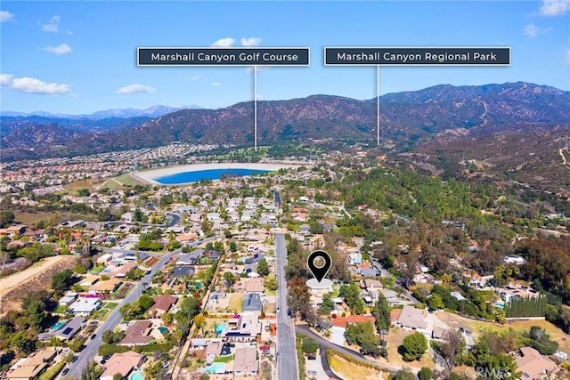 birds eye view of property with a mountain view