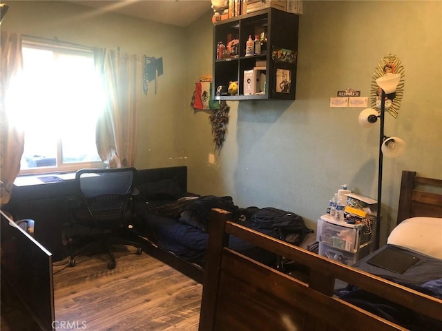 bedroom featuring wood finished floors