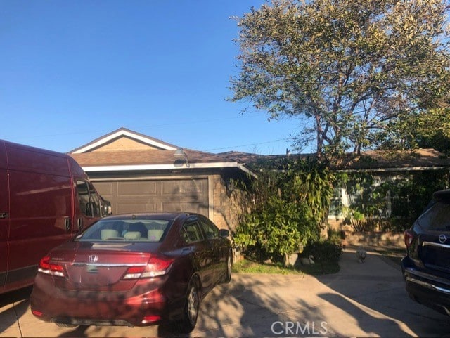 exterior space with a garage