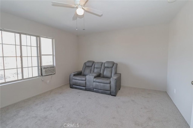 living area with carpet flooring, cooling unit, and a ceiling fan