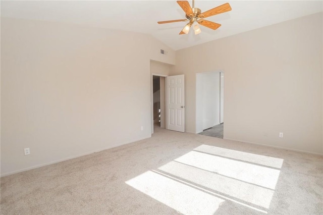 spare room with visible vents, lofted ceiling, ceiling fan, and carpet flooring