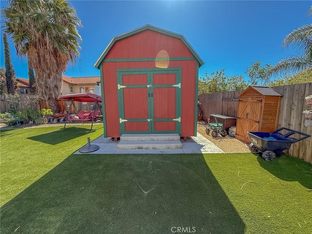 view of shed featuring a fenced backyard