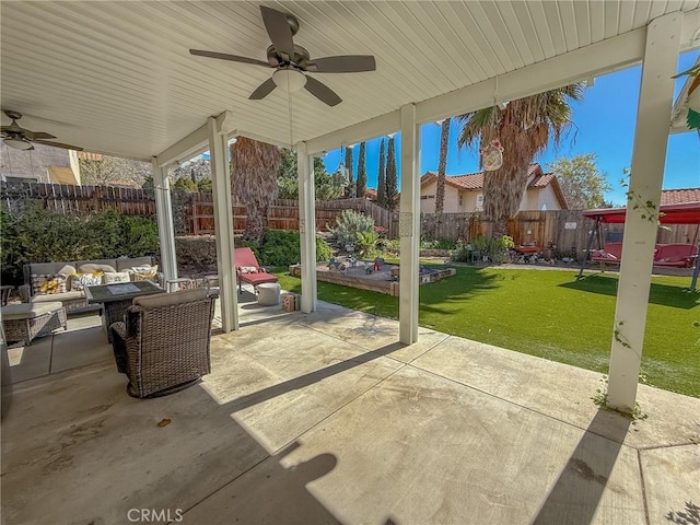 view of patio / terrace with a fenced backyard and a ceiling fan