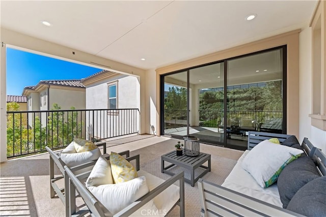 view of patio featuring a balcony and outdoor lounge area