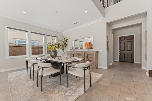 dining room with baseboards, recessed lighting, visible vents, and crown molding