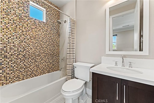 full bath with shower / bath combo, vanity, and toilet