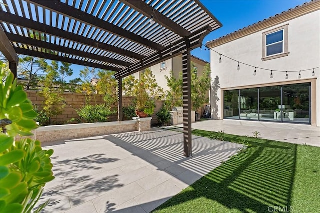 view of patio featuring a fenced backyard and a pergola