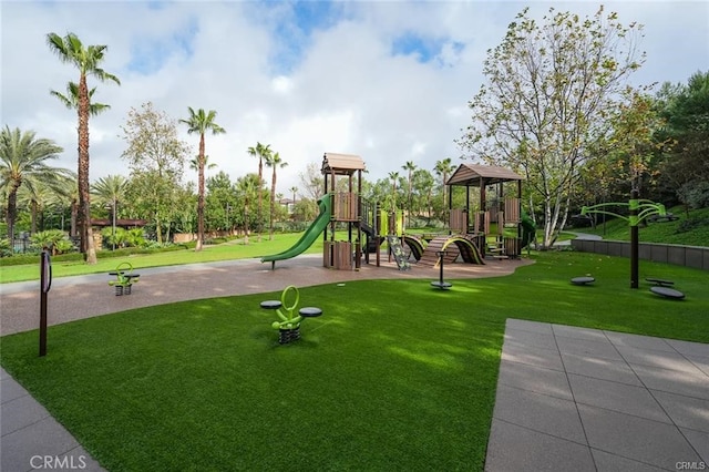 communal playground with a lawn