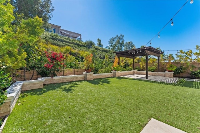 view of yard with a patio, a fenced backyard, and a pergola