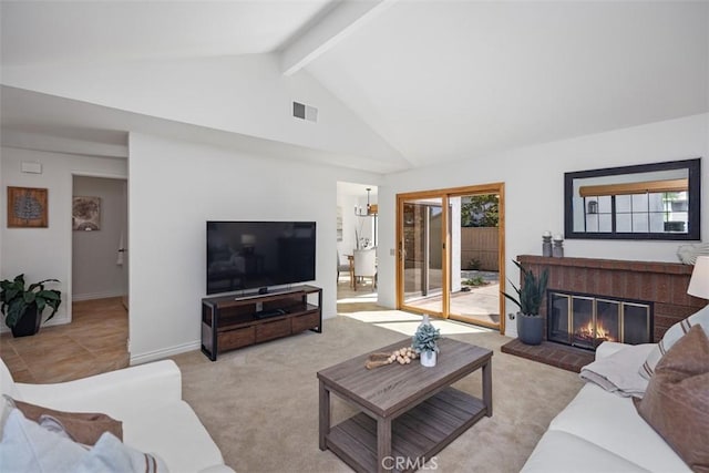 living room with carpet floors, beam ceiling, a fireplace, visible vents, and high vaulted ceiling