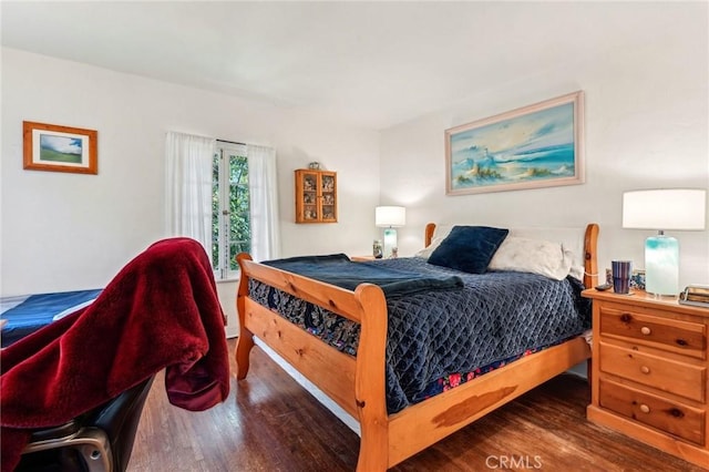 bedroom with wood finished floors