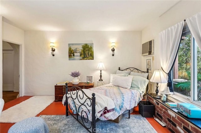 bedroom with a wall mounted air conditioner