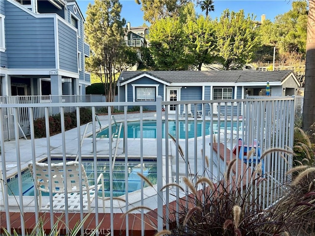 community pool featuring fence