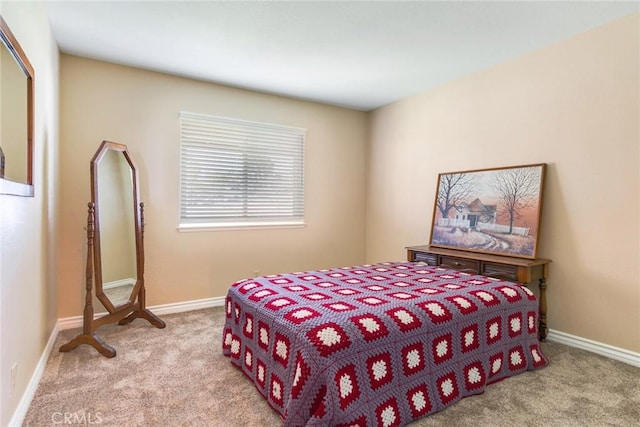 bedroom featuring carpet flooring and baseboards