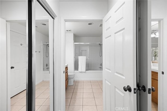 bathroom with shower / bath combination with glass door, tile patterned flooring, visible vents, and vanity