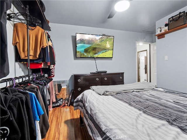 bedroom with wood finished floors and a ceiling fan