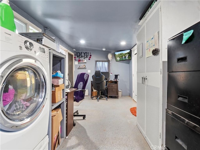 laundry area with washer / dryer, laundry area, and a healthy amount of sunlight