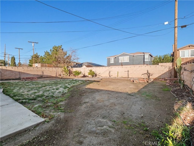 view of yard featuring a fenced backyard