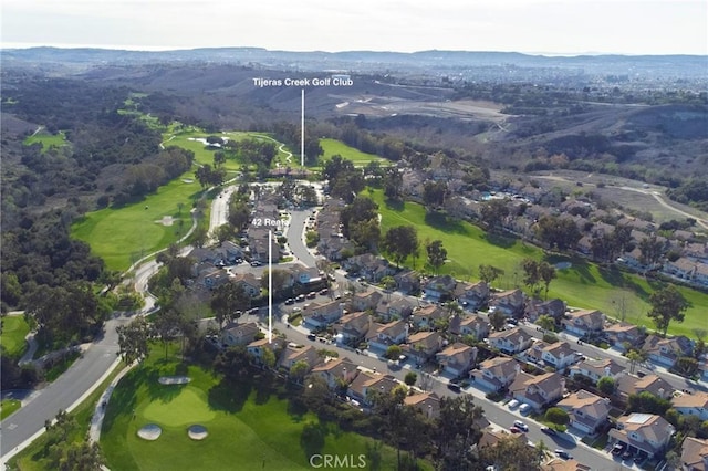 birds eye view of property with a residential view and golf course view