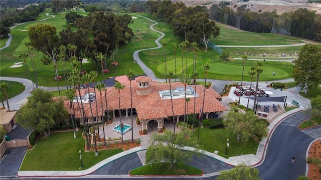 birds eye view of property with view of golf course