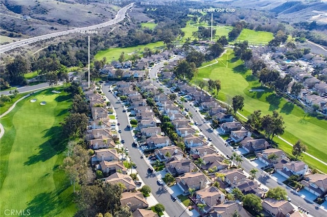 birds eye view of property featuring golf course view and a residential view