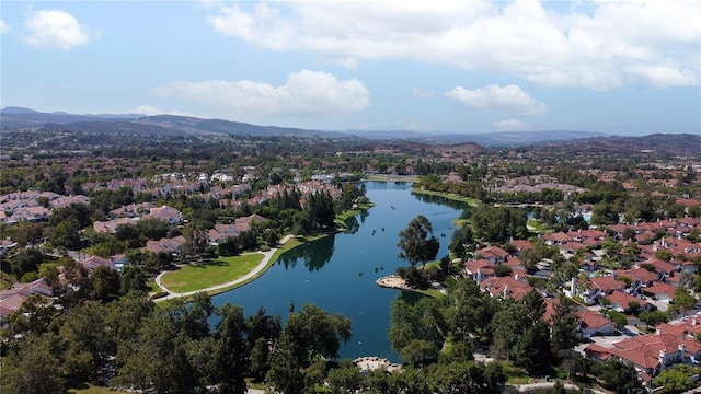 bird's eye view with a residential view and a water and mountain view