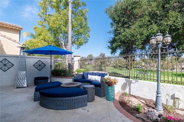 view of patio featuring fence