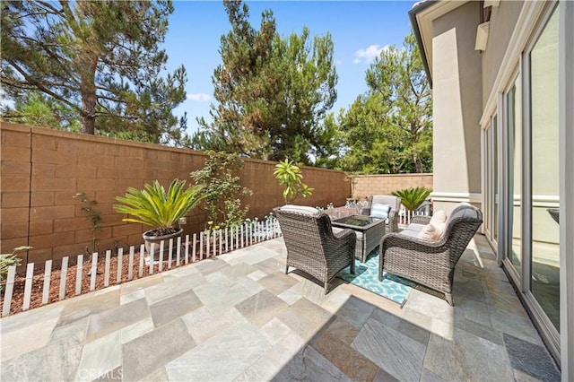 view of patio featuring a fenced backyard and an outdoor living space