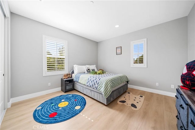 bedroom featuring recessed lighting, baseboards, and wood finished floors