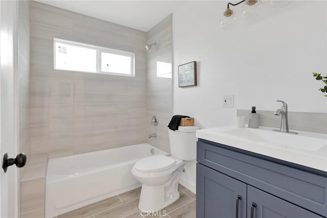 full bathroom with tub / shower combination, vanity, and toilet