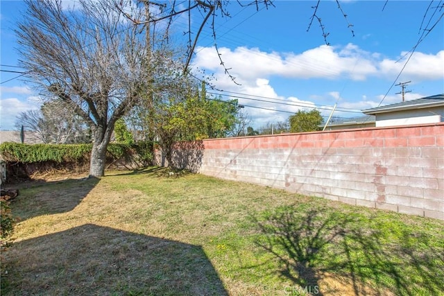 view of yard featuring a fenced backyard