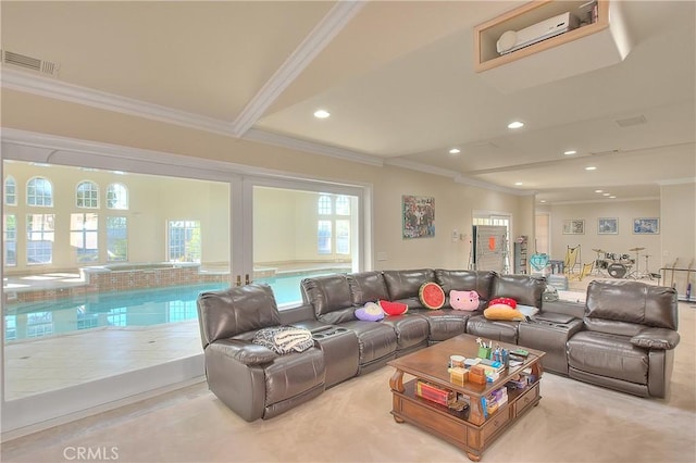 living room with recessed lighting, visible vents, and crown molding