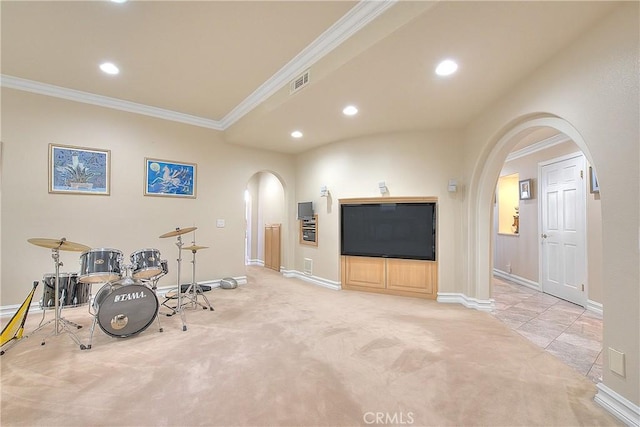 interior space featuring arched walkways, visible vents, crown molding, and carpet