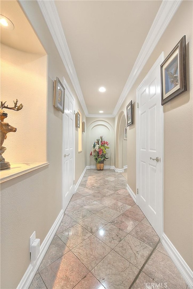 hallway featuring ornamental molding, recessed lighting, and baseboards