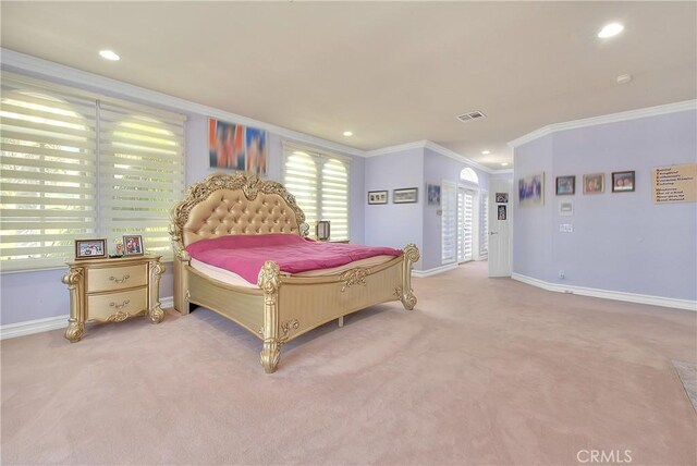 carpeted bedroom with baseboards, visible vents, crown molding, and recessed lighting