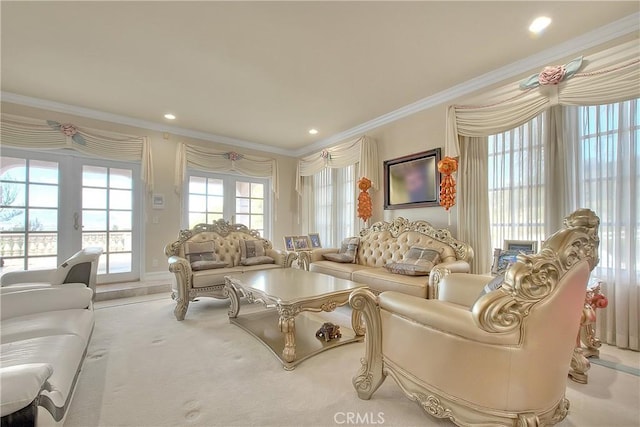 carpeted living area with french doors, recessed lighting, and crown molding