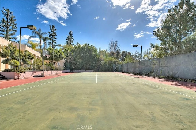 view of sport court featuring community basketball court and fence