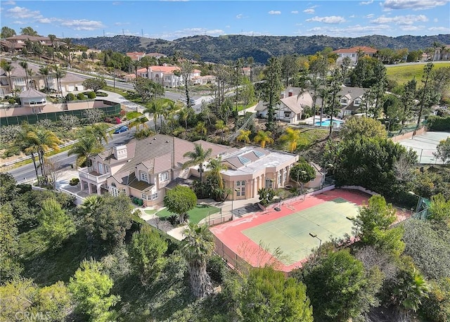 drone / aerial view with a residential view and a mountain view