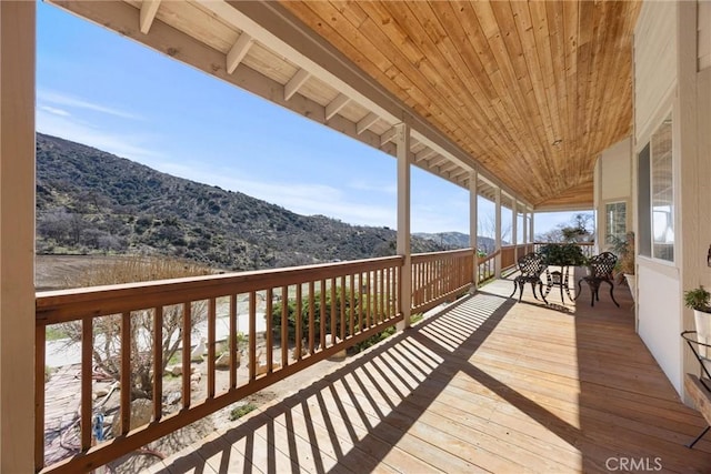 wooden terrace featuring a mountain view