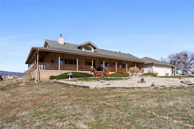 view of front of property with a chimney and an attached garage