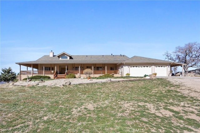 view of front facade with a garage, driveway, a chimney, a porch, and a carport