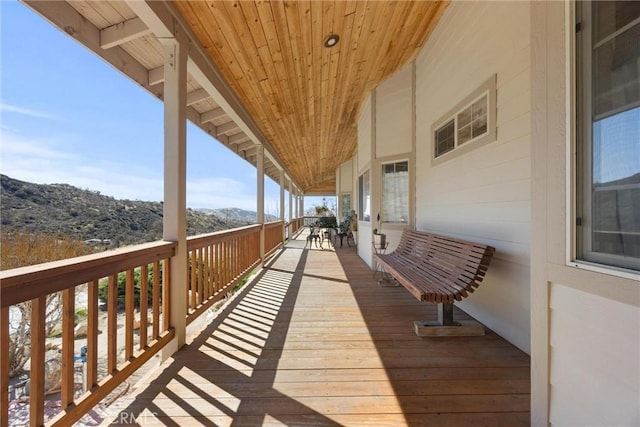 wooden deck with a mountain view