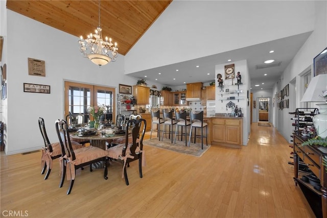 dining area with wooden ceiling, an inviting chandelier, light wood-style floors, high vaulted ceiling, and recessed lighting