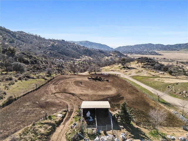 drone / aerial view featuring a rural view and a mountain view