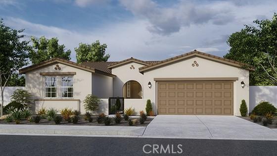 mediterranean / spanish-style home with a garage, a tiled roof, concrete driveway, and stucco siding