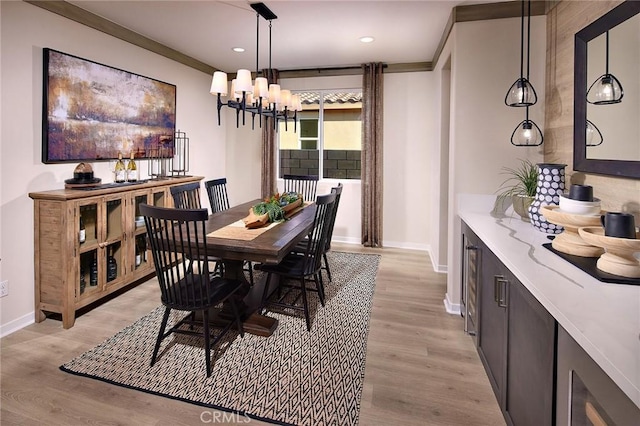 dining space featuring light wood-type flooring, baseboards, and recessed lighting