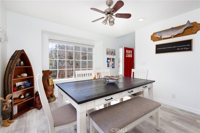 dining space featuring recessed lighting, light wood-type flooring, a ceiling fan, and baseboards