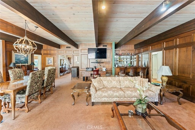 living room featuring bar, light carpet, visible vents, beamed ceiling, and an inviting chandelier