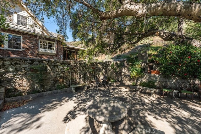 view of patio / terrace with fence